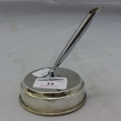 A silver pen holder