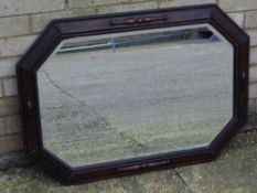 An early 20th century oak framed mirror