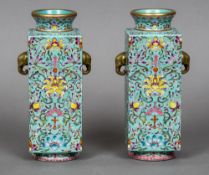 A pair of Chinese porcelain vases Each of square form with twin elephant mask handles,