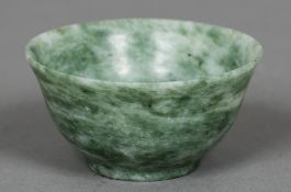 A small Chinese jade bowl Of simple flared form. 10 cm diameter.