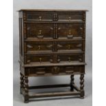 An 18th century oak geometric moulded chest on stand The moulded rectangular top above an