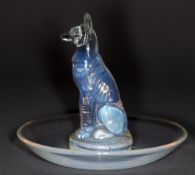 A Lalique clear and opalescent glass chien cendrier Engraved R Lalique, France No. 290. 9 cm high.