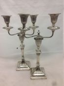 A pair of Victorian silver twin branch candelabra, the bases hallmarked Sheffield 1888,