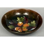 A William Moorcroft pottery bowl Decorated with the Hibiscus pattern,