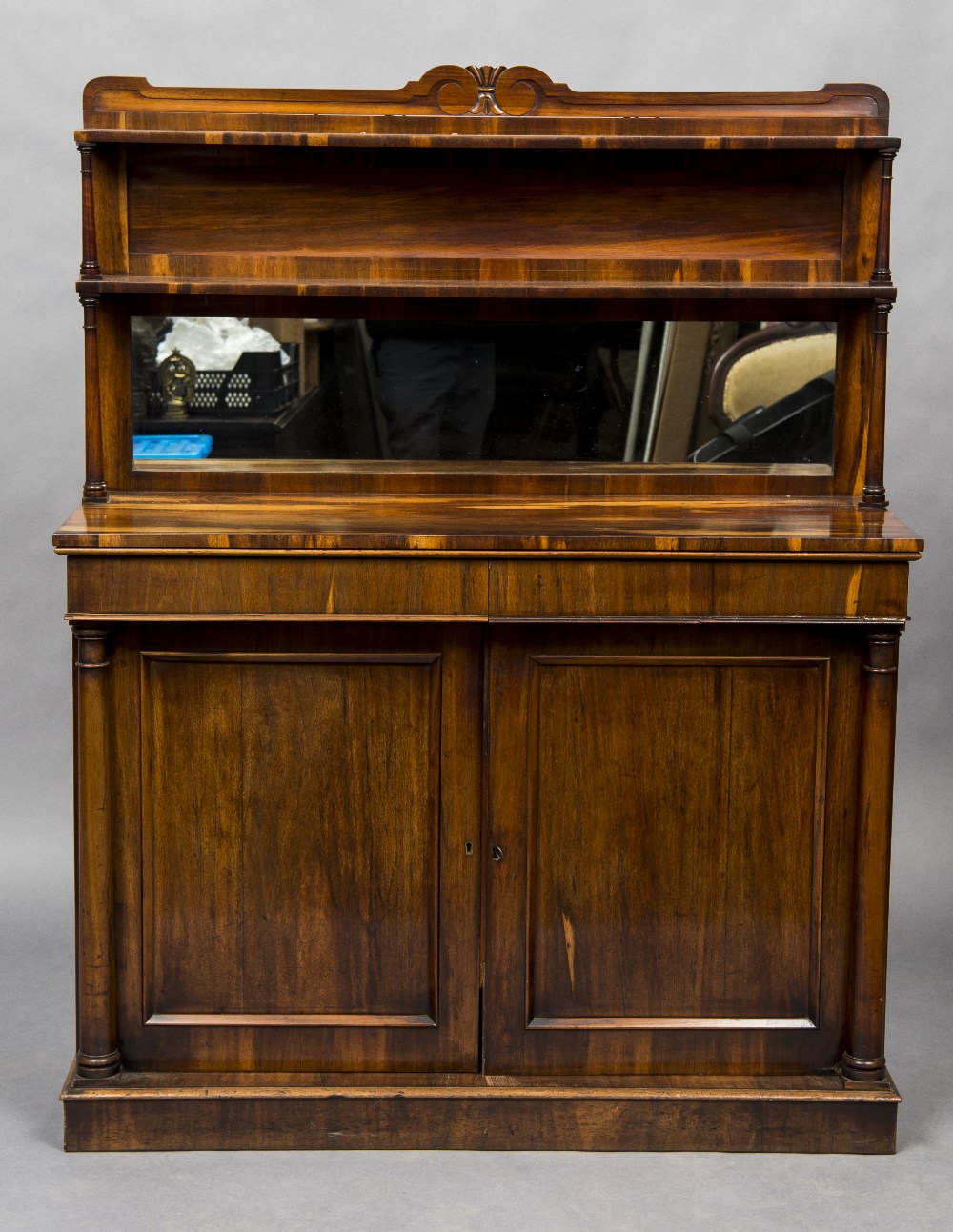 A 19th century rosewood chiffonier With shaped twin tiered mirror backed above two frieze drawers