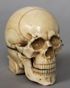 An ivory cased desk timepiece The case worked as a skull,