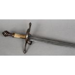 A 16th century German hand-and-a-half sword The channelled blade with Passau running wolf mark,