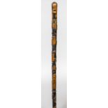 An early 19th century carved walking stick Carved with a bust of Wellington and inscribed