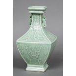 A Chinese porcelain twin handled baluster vase Of square section, worked with archaistic motifs,