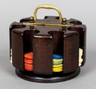 An early 20th century mahogany gaming chip holder Of revolving cylindrical form,