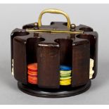 An early 20th century mahogany gaming chip holder Of revolving cylindrical form,