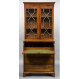 A George III mahogany secretaire bookcase The moulded top above astragal glazed doors enclosing