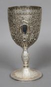 A white metal trophy cup,