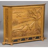 A quarter sawn light oak fire screen Carved with pheasants in a field,