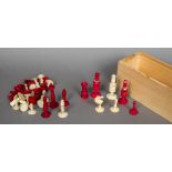 A mid 19th century ivory and stained ivory chess set Together with another ivory chess set.