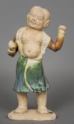 A Chinese pottery model of a Han dynasty boxer Modelled standing in open robe with fists clenched.