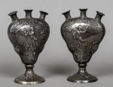 A pair of 19th century Continental silver bud vases,