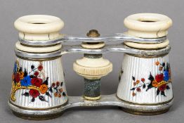 A pair of early 20th century enamel decorated and ivory mounted opera glasses Each barrel decorated