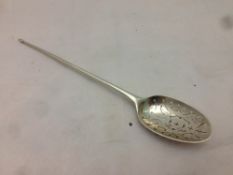 A Georgian silver moat spoon The pierced bowl with plain stem and pointed finial. 18.5 cm long.