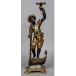 A late 19th/early 20th century Venetian painted carved wooden Blackamoor Modelled as a gondolier