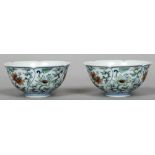 A pair of Chinese Wucai porcelain tea bowls Each with scalloped rim and decorated with lotus