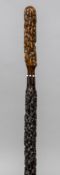 A 19th century walking stick Carved to resemble an umbrella. 87.5 cm long.