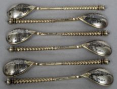 A set of six Russian silver gilt and niello decorated coffee spoons,