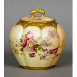 A Royal Worcester blush ivory lidded vase Of lobed form with floral decoration. 17 cm high.