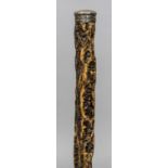 An unusual 19th century cork walking stick Mounted with a white metal knop handle. 84 cm long.