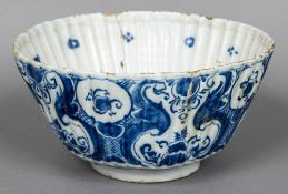 An 18th century Delft blue and white bowl Of ribbed form,