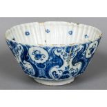 An 18th century Delft blue and white bowl Of ribbed form,