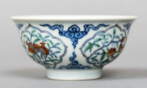 A Chinese porcelain tea bowl,