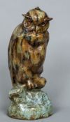 A 19th century Continental pottery lamp base Modelled as an owl with mottled glaze. 45 cm high.
