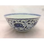 A Chinese blue and white porcelain bowl With incised dragon decoration and decorated with lotus