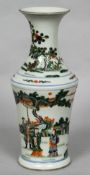 A Chinese porcelain vase Decorated with figures in a continuous landscape,