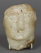 An antique marble bust, possibly Syrian With simply carved features. 13 cm long.