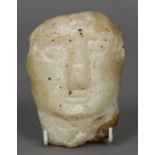 An antique marble bust, possibly Syrian With simply carved features. 13 cm long.