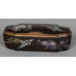 A 19th century mother-of-pearl inlaid lacquered box Of shaped hinged form,