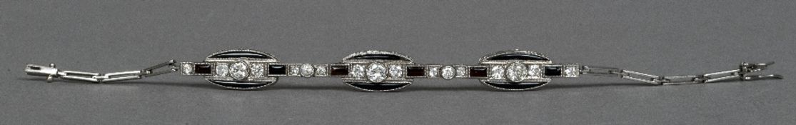 An Art Deco platinum, onyx and diamond set bracelet 17 cm long.