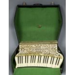 A Hohner Organetta III accordion Of typical form with mottled white casing,