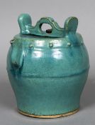 A Chinese porcelain wine ewer With allover turquoise glaze, inscribed CAT176 EARLY MING to base.