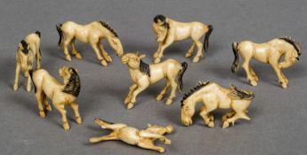 Eight 19th/20th century Chinese ivory carved and stained horses Variously posed.