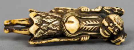 A 19th century Japanese carved ivory netsuke Carved with a figure of Gamasennin with two toads on