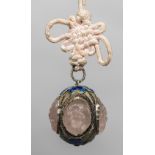 A Chinese white metal rose quartz set and enamelled pendant The panels florally carved and pierced,