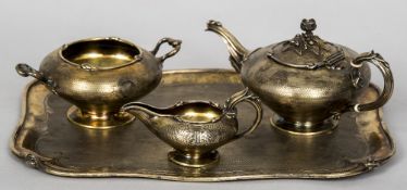 A French silver gilt three piece tea set and tray, with 950 Minerva's Head Fineness mark,