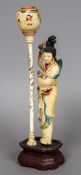 An early 20th century Chinese Republic period carved and stained ivory figure Worked as a woman