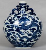 A Chinese blue and white porcelain twin handled moon flask Decorated with five-clawed dragons and