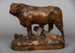 JOHANN HUGGLER (1834-1912) Swiss A Black Forest carved wood figure of a bull,