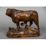 JOHANN HUGGLER (1834-1912) Swiss A Black Forest carved wood figure of a bull,