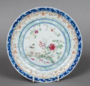 A Chinese porcelain plate Enamel decorated with a chicken and a praying mantis among floral sprays